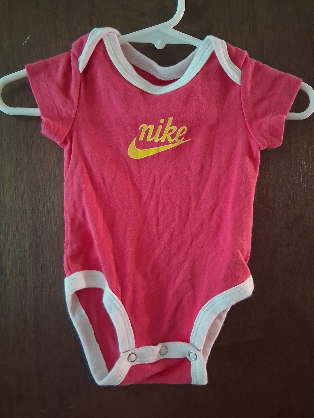 Nike Pink Baby One-Piece Bodysuit with Yellow Logo